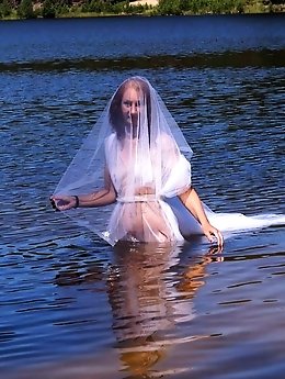 An older woman with perfect breast shape.