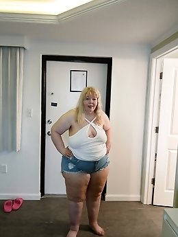 A blonde is indulging in solo pleasure while her husband is at work