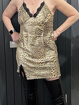 My mother is posing partially undressed