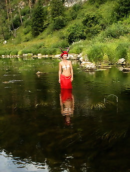 With Horns In Red Dress In Shallow River