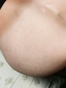 A voluptuous woman in her prime is pleasuring herself.